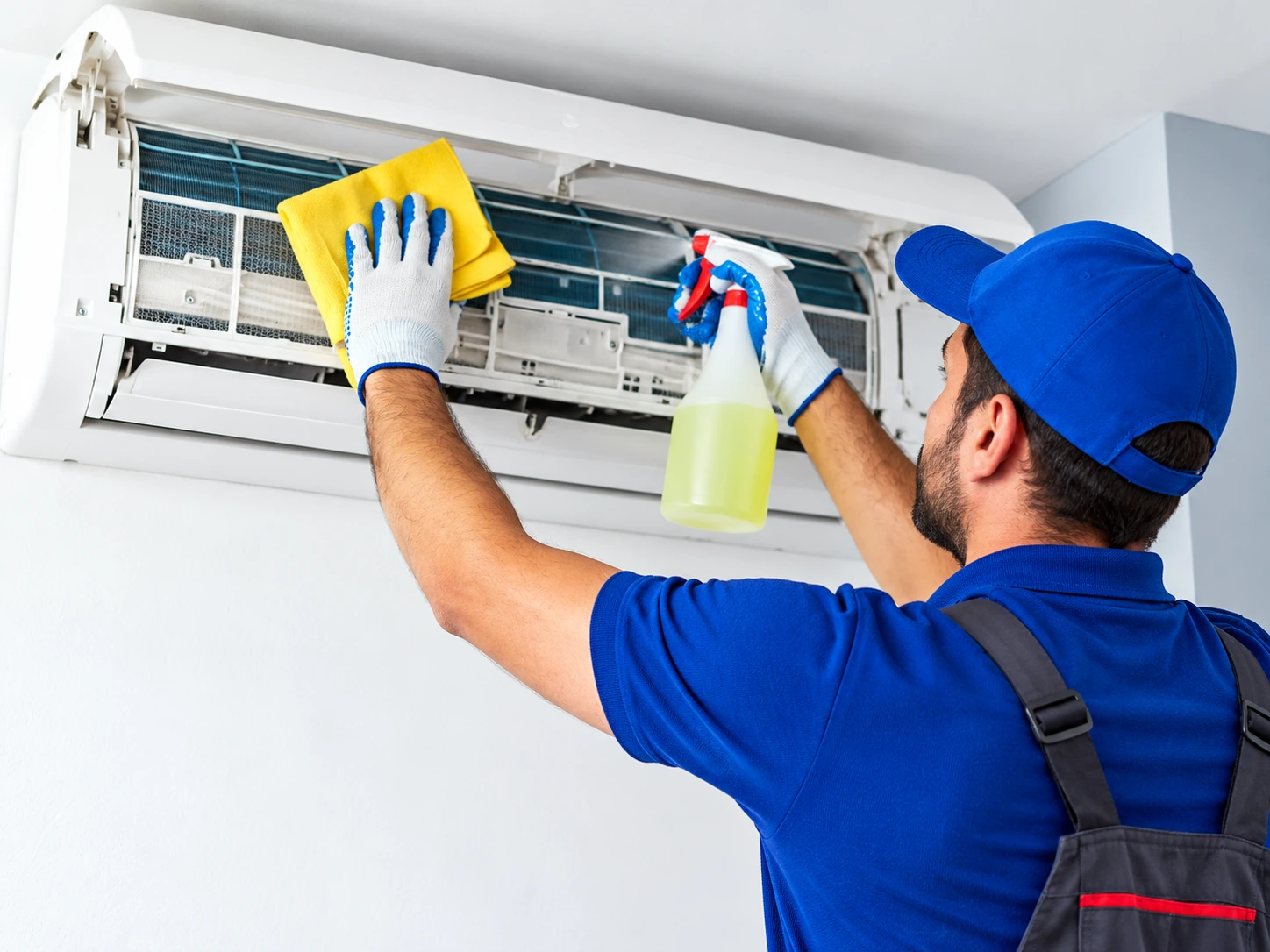 Air conditioner filters and indoor unit being serviced
